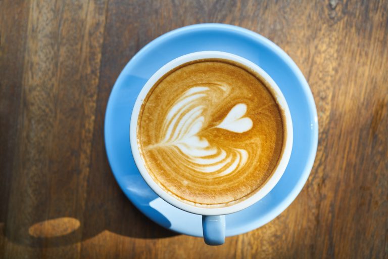 Canva - Blue Ceramic Coffee Mug on Saucer