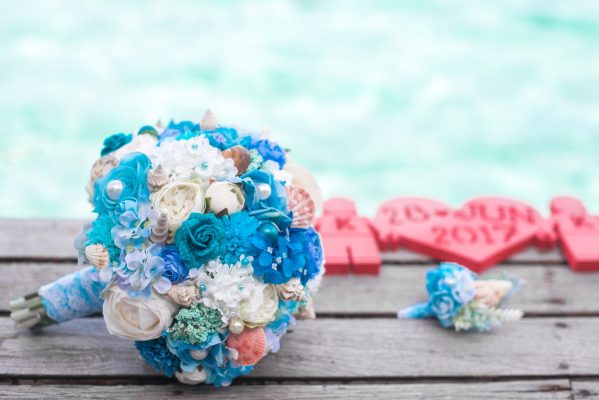 Canva - Bouquet of Blue and White Flowers on Top of Brown Surface