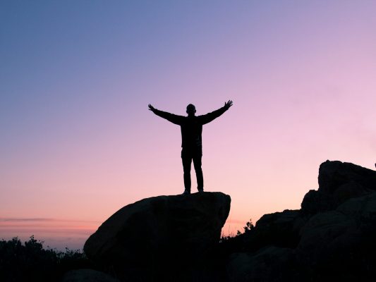 Canva - Silhouette of Man Raising His Hands