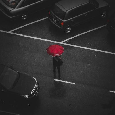 Canva - Person Holding Red Umbrella Walking on Street