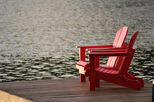Canva - Red Wooden Chairs on the Pier