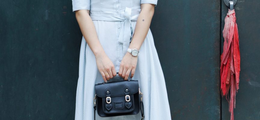 Canva - Woman Holding Black Leather Bag